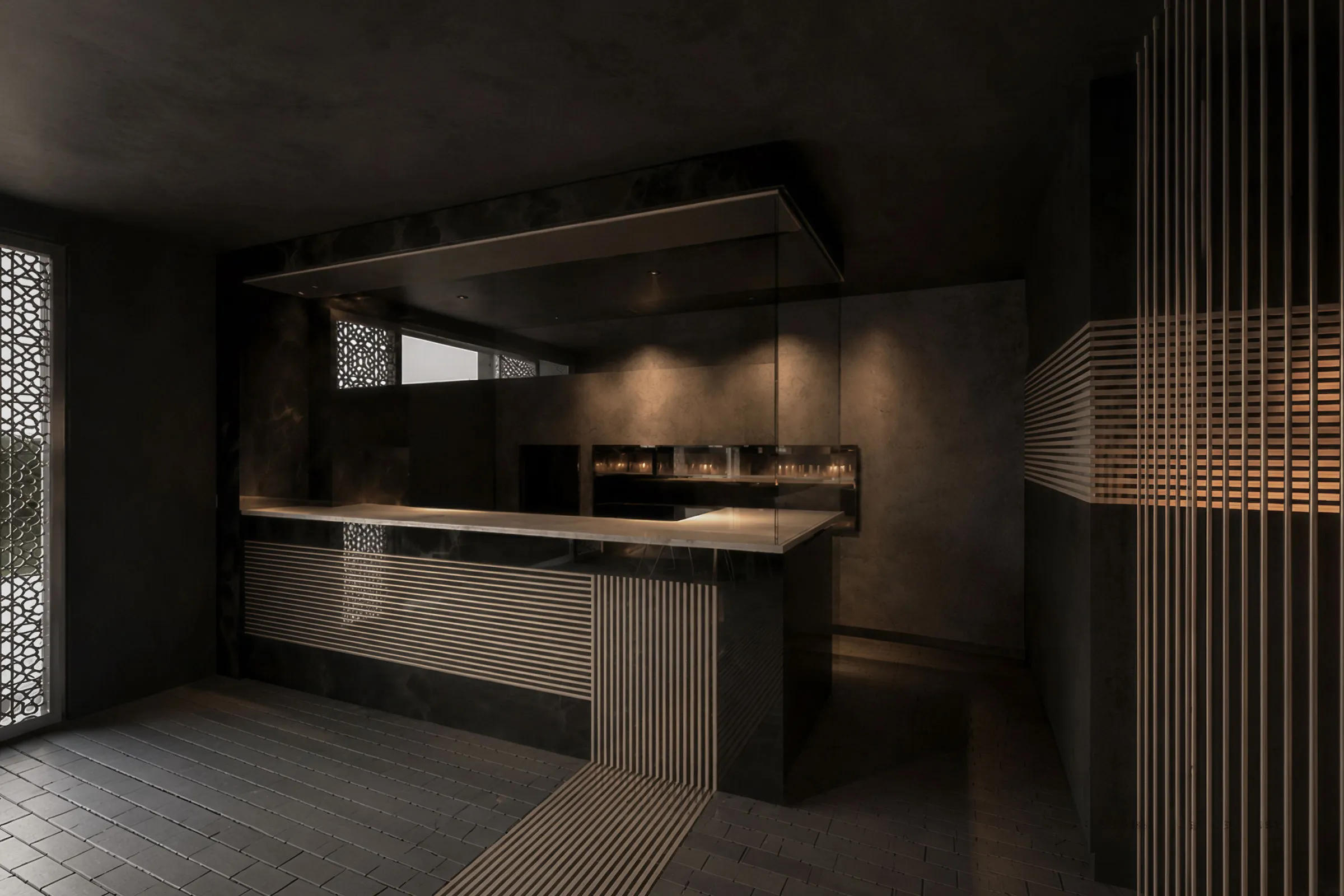 Dark contemporary Anar restaurant service counter with grey stone, copper-toned detailing, vertical screens and focused lighting.