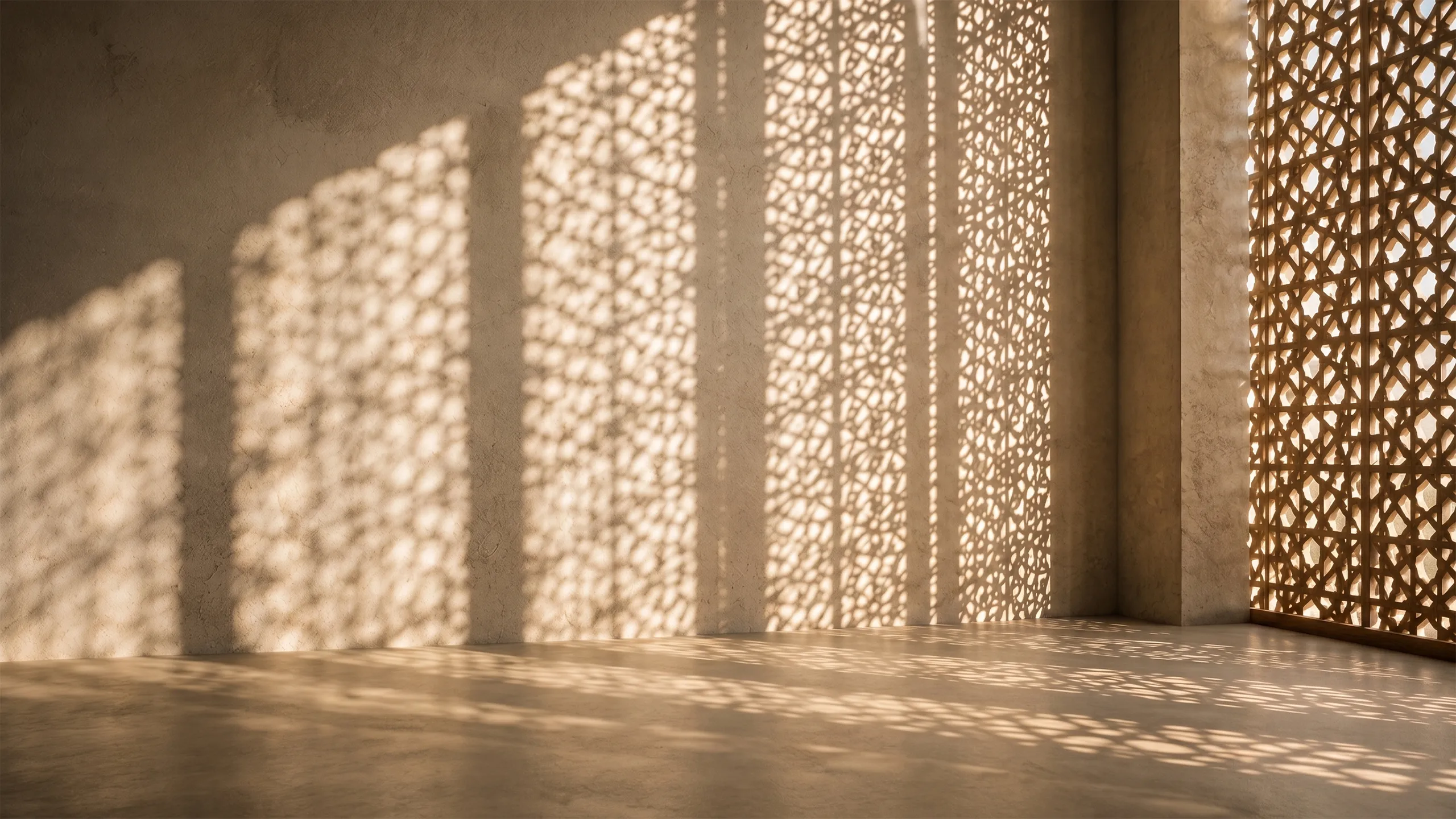Patterned sunlight and intricate shadows cast through a geometric screen across warm plaster walls and floor.